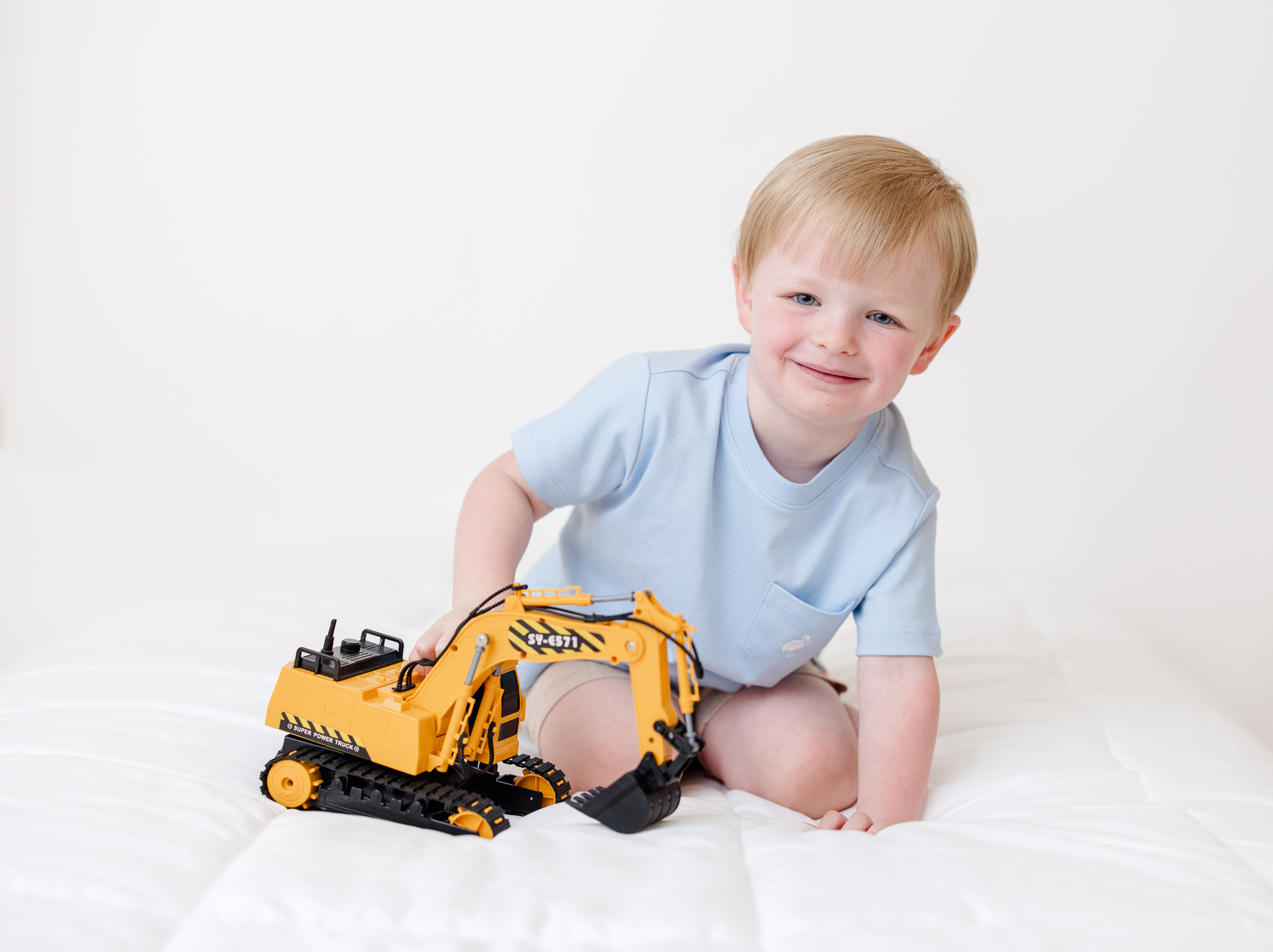 kids wearing blue shirt during in home photo session in Duluth Georgia