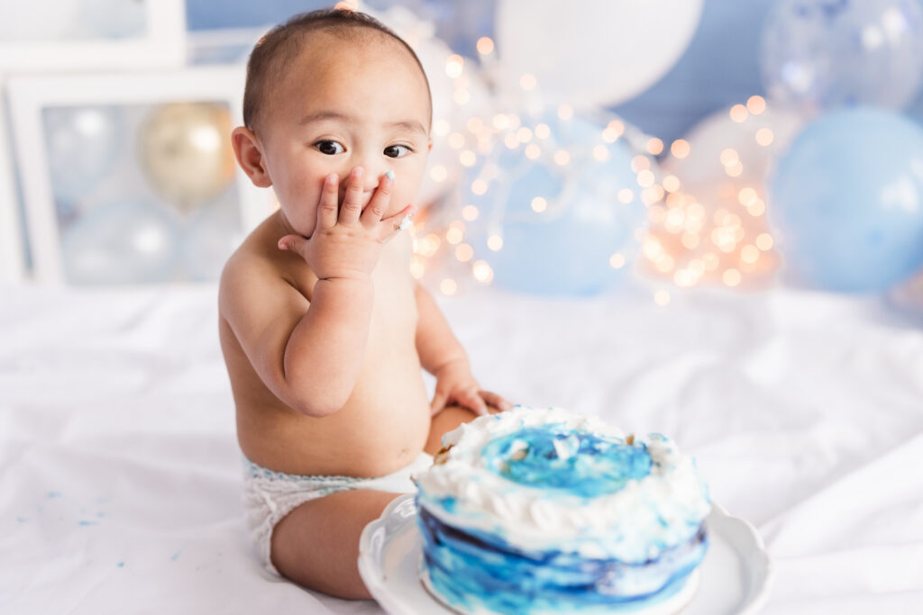 indoor smash cake portrait of a one year old boy